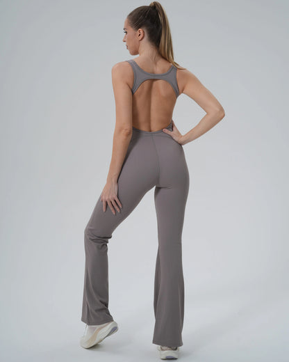 Woman in Bandsam VitalFlare Jumpsuit, showcasing flared leg activewear ideal for yoga, pilates, or lounging. Stretchy, soft, and supportive.