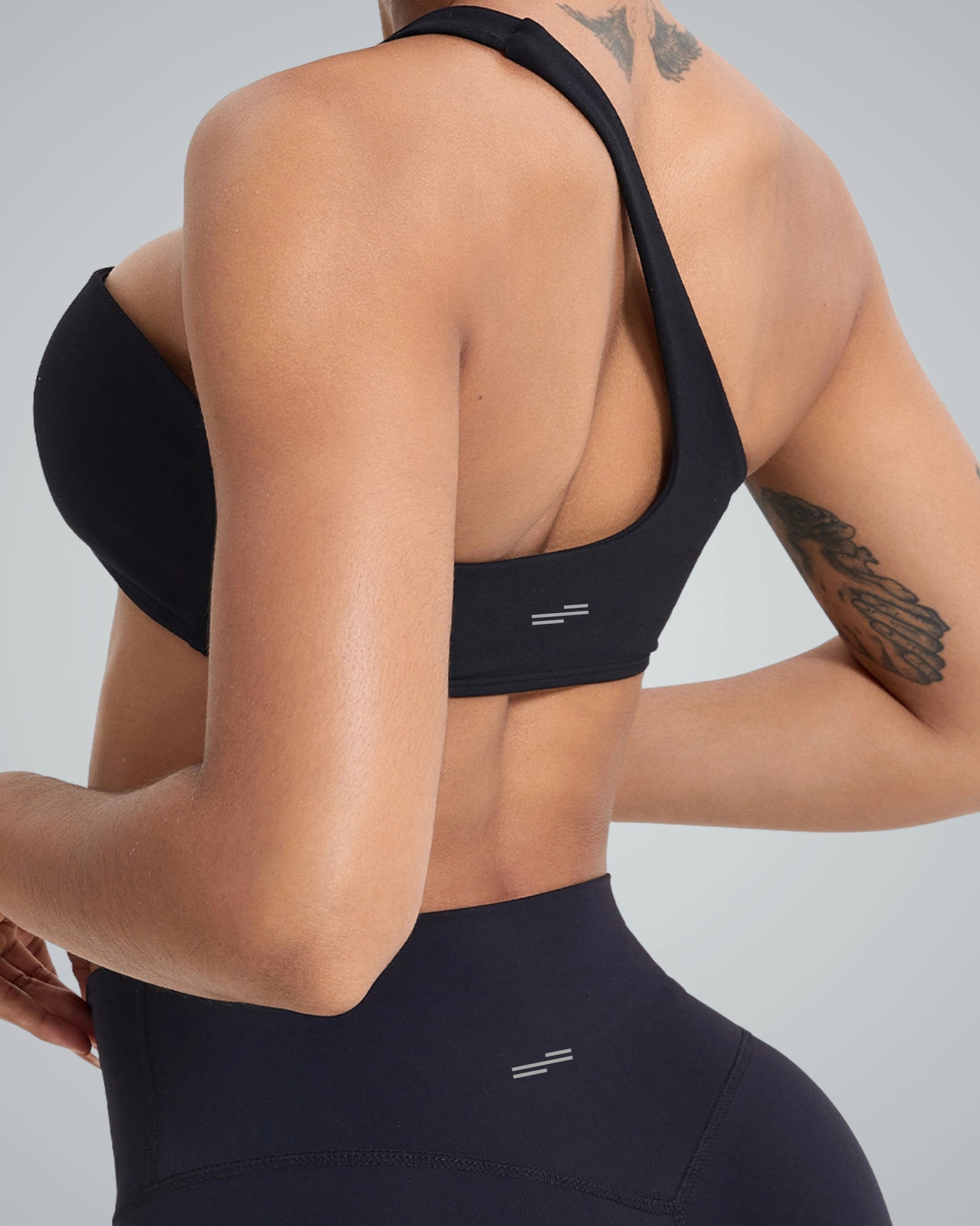 Woman wearing Bandsam Zenith Solo Bra, ideal for yoga and workout. Soft, stretch activewear offering comfort and support.