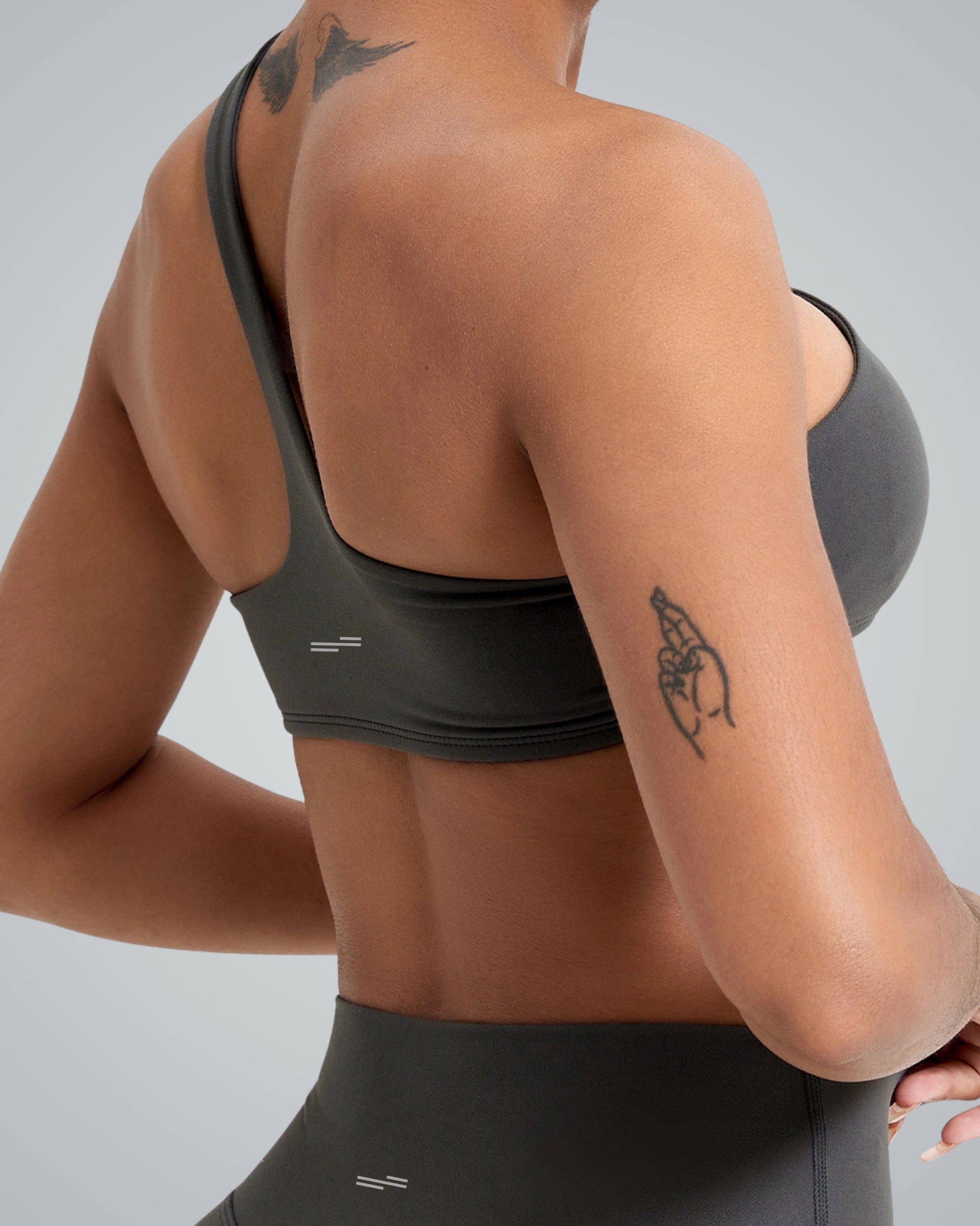 Woman wearing Bandsam Zenith Solo Bra, showcasing soft, stretchy activewear ideal for yoga and workouts. Perfect blend of comfort and style.