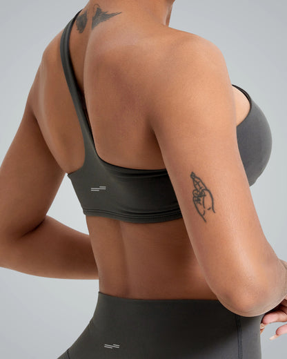 Woman wearing Bandsam Zenith Solo Bra, showcasing soft, stretchy activewear ideal for yoga and workouts. Perfect blend of comfort and style.